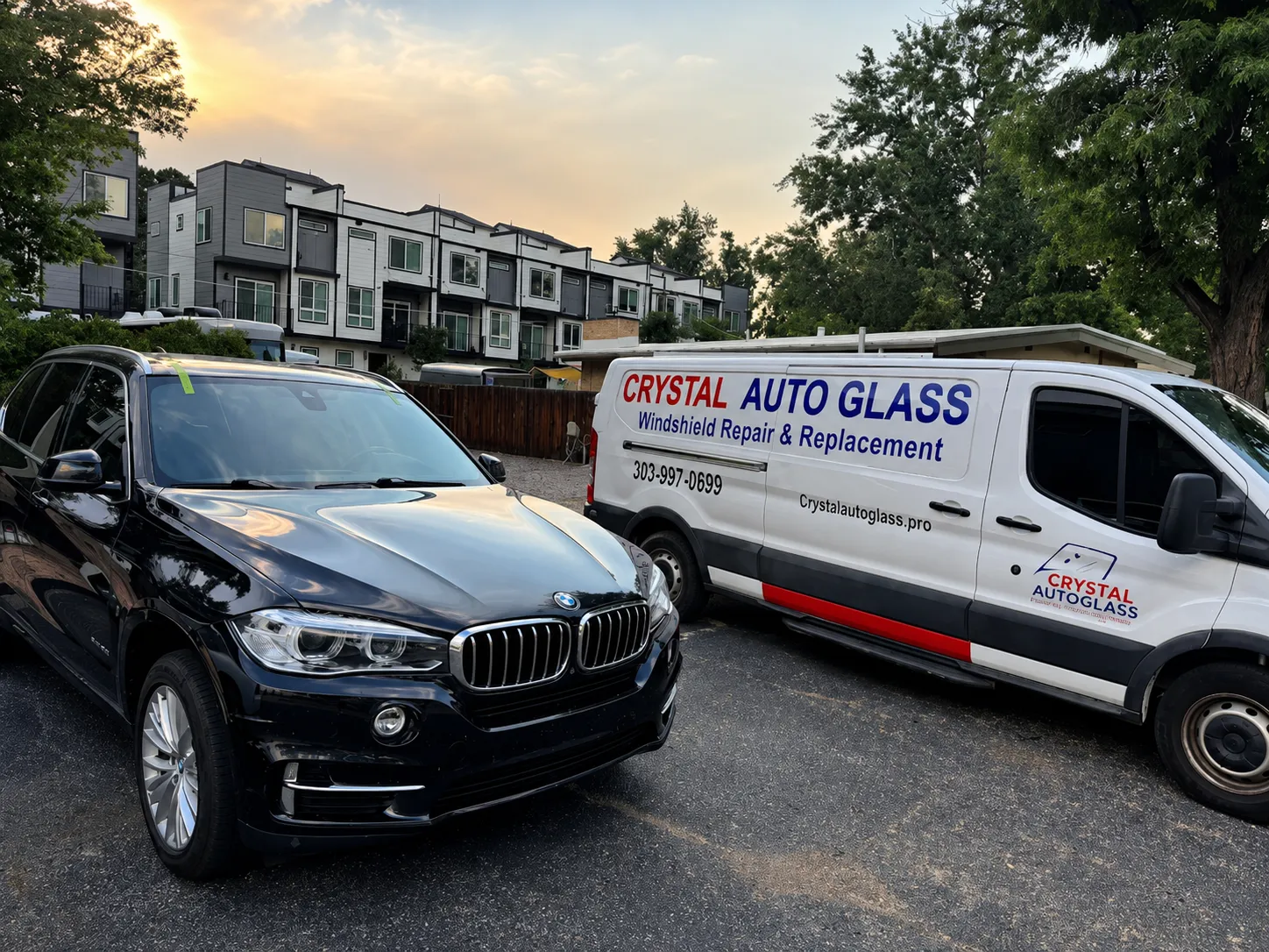 Auto glass technician applying windshield installation adhesive